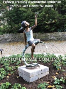 Enchanted Butterfly fantasy bronze sculpture of girl sitting on giant leaf with butterfly