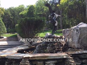 Fish Thieves bronze sculpture of monumental eagles fighting over captured salmon