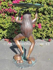 Frog Under Leaf gallery quality standing frog holding up leaf umbrella to shelter from water fountain