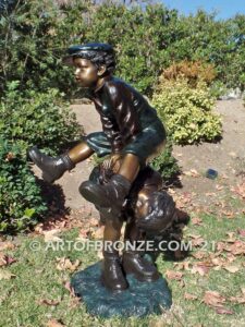 Leapfrog bronze sculpture of boy jumping over his brother