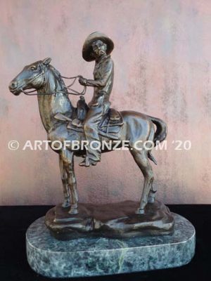 On the Range bronze sculpture of western cowboy on cattle horse