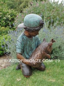 Play Pal bronze sculpture of young boy holding his dog