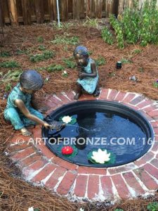 Ready for the Race bronze sculpture of boy playing with his pet painted turtle