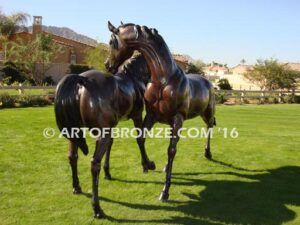 Romance bronze sculpture of standing mare and running colt horse for Griffin Ranch in La Quinta, CA