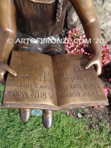 Study Time bronze sculpture of young reader girl sitting on bronze stump