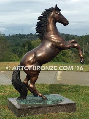 Thunderstorm sculpture of reared horse with forelegs off the ground and hind legs attached bronze base