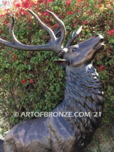 Unyielding Terrain Heroic bronze bull elk standing on rocky base design with head raised in bugling position