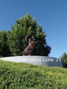 Wild Country sculpture of reared horse with forelegs off the ground and hind legs attached bronze base