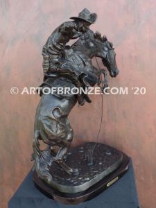 Bronco Buster bronze sculpture after Frederic Remington of cowboy ranger on horse in white house