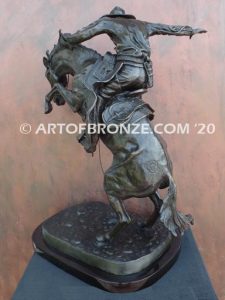 Bronco Buster bronze sculpture after Frederic Remington of cowboy ranger on horse in white house