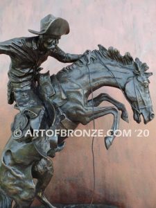 Bronco Buster bronze sculpture after Frederic Remington of cowboy ranger on horse in white house