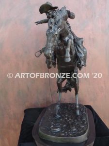 Bronco Buster bronze sculpture after Frederic Remington of cowboy ranger on horse in white house