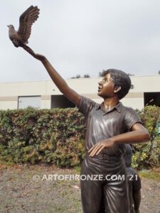 High Hopes bronze sculpture of four children playing on bronze rock for park or school playground