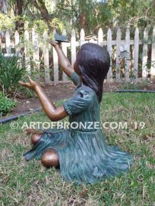 Wings of Joy II bronze sculpture of girl with butterflies on her dress and hands