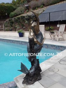 Bronze mermaid sculpture holding oyster shell for pond, pool or aquatic display