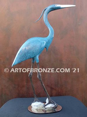 Heron in Everglades sculpture graceful heron looking in the everglades by British artist Brian Arthur
