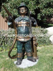 Junior Fireman bronze sculpture of firefighter boy wearing helmet and turnout coat