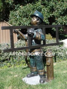 Junior Fireman bronze sculpture of firefighter boy wearing helmet and turnout coat