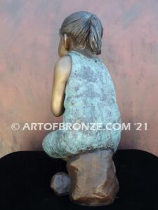 Cutie Pie bronze sculpture of girl sitting down and daydreaming