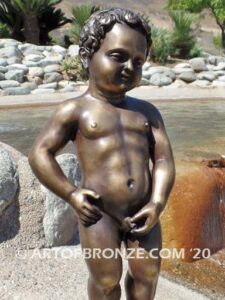 Manneken Pis 17th century bronze sculpture of naked little boy peeing into fountain