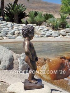 Manneken Pis 17th century bronze sculpture of naked little boy peeing into fountain