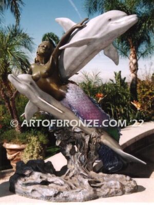 Neptunes Delight Bronze sculpture of mermaid swimming with dolphins for pool or water feature