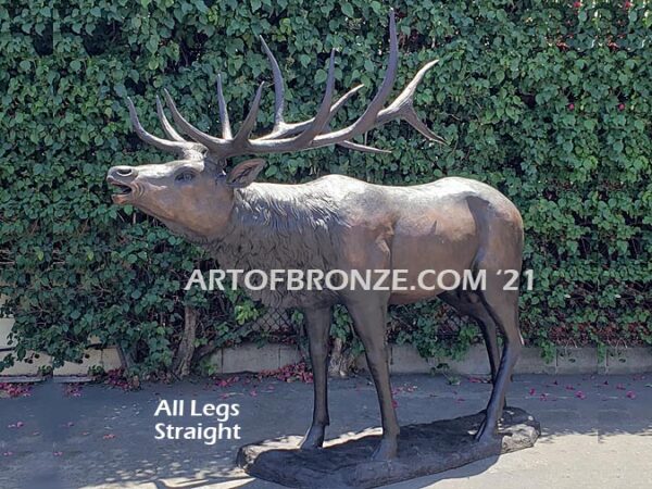 Heroic bronze bull elk standing on rocky base design with head raised in bugling position