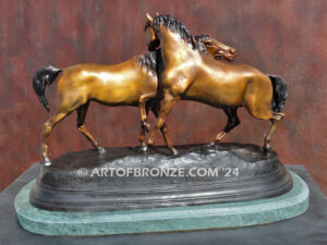 L’Accolade equestrian sculpture of standing stallion and Arabian mare from French animalier artist P.J. Mene.