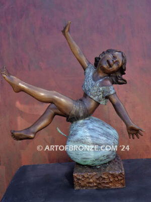 Apple of My Eye fantasy bronze statue of girl playing atop apple