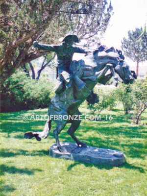 The Bronco Buster bronze sculpture after Frederic Remington featuring cowboy on horse