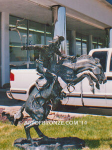 The Bronco Buster bronze sculpture after Frederic Remington featuring cowboy on horse