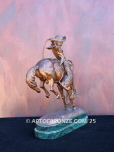 The Buckaroo bronze statue after Phimister Proctor featuring cowboy on horse