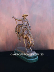 The Buckaroo bronze statue after Phimister Proctor featuring cowboy on horse