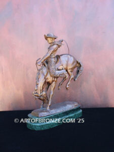 The Buckaroo bronze statue after Phimister Proctor featuring cowboy on horse