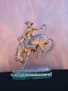 The Buckaroo bronze statue after Phimister Proctor featuring cowboy on horse