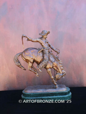 The Buckaroo bronze statue after Phimister Proctor featuring cowboy on horse