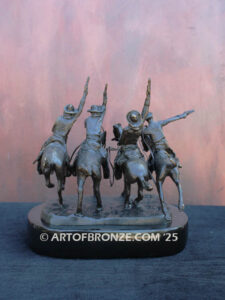 Coming Thru the Rye bronze sculpture after Frederic Remington featuring four horseman on galloping horses