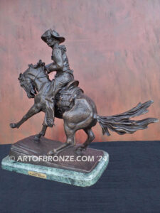 The Cowboy bronze sculpture after Frederic Remington featuring cowboy on horse