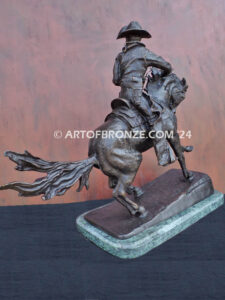 The Cowboy bronze sculpture after Frederic Remington featuring cowboy on horse