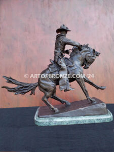 The Cowboy bronze sculpture after Frederic Remington featuring cowboy on horse