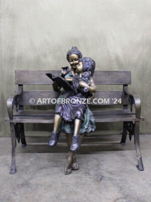 Mom Knows Best Bronze sculpture of little girl sitting on moms lap being read a book