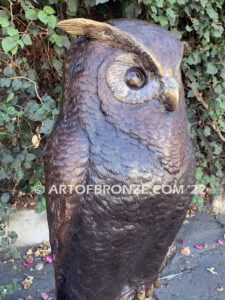 Moonlight Guardian whimsical giant bronze owl statue resting on branch