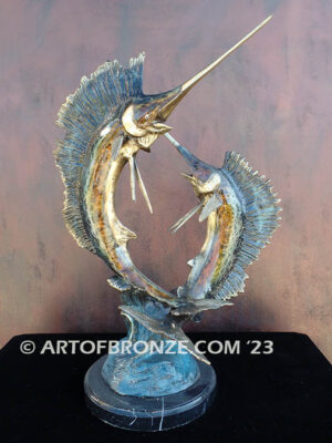 Parlay bronze sculpture of two sailfish leaping upward above ocean waves on marble base