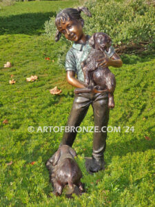 Play with me too charming bronze statue of girl playing with puppy dogs