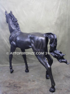 Prancing Delight bronze sculpture of running foal with flowing mane and tail with strong muscle details