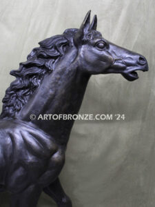 Prancing Delight bronze sculpture of running foal with flowing mane and tail with strong muscle details