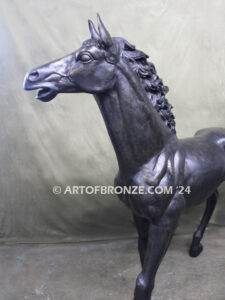 Prancing Delight bronze sculpture of running foal with flowing mane and tail with strong muscle details