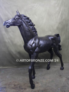 Prancing Delight bronze sculpture of running foal with flowing mane and tail with strong muscle details