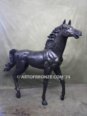 Prancing Delight bronze sculpture of running foal with flowing mane and tail with strong muscle details