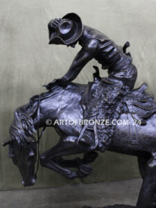 Rattlesnake bronze statue cowboy on bucking horse after Frederic Remington